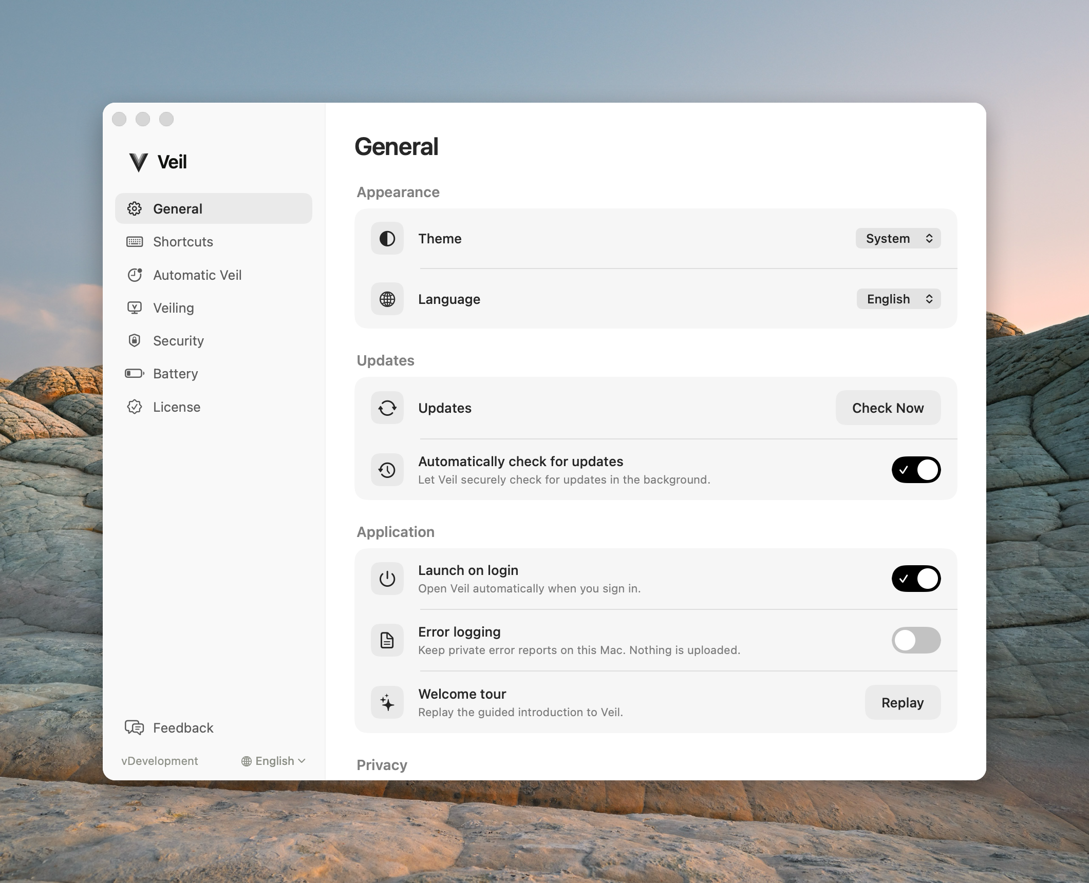 General settings with Theme System, Language English, Automatically check for updates on, and Launch on login on